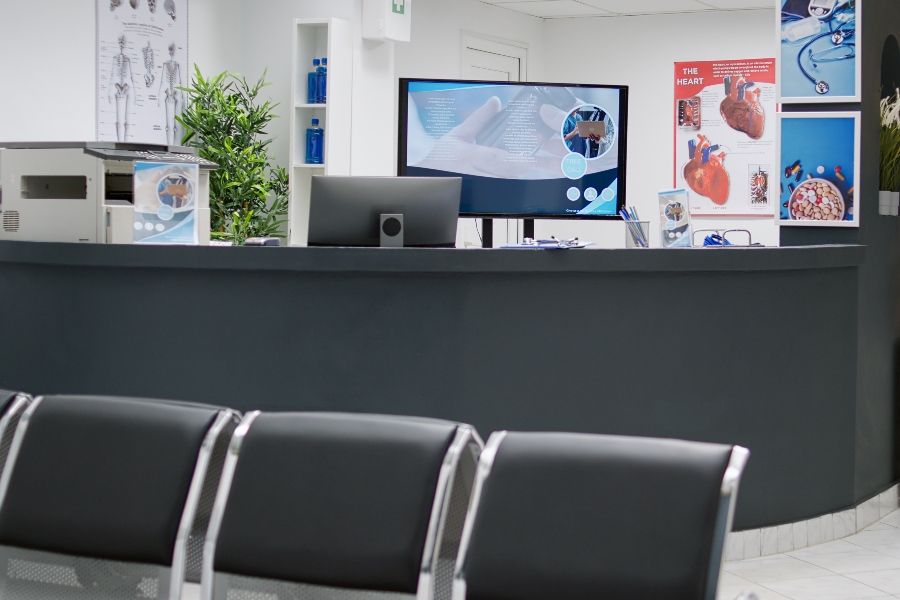 empty-reception-counter-waiting-room-attend-medical-appointment-with-general-900x600.jpg