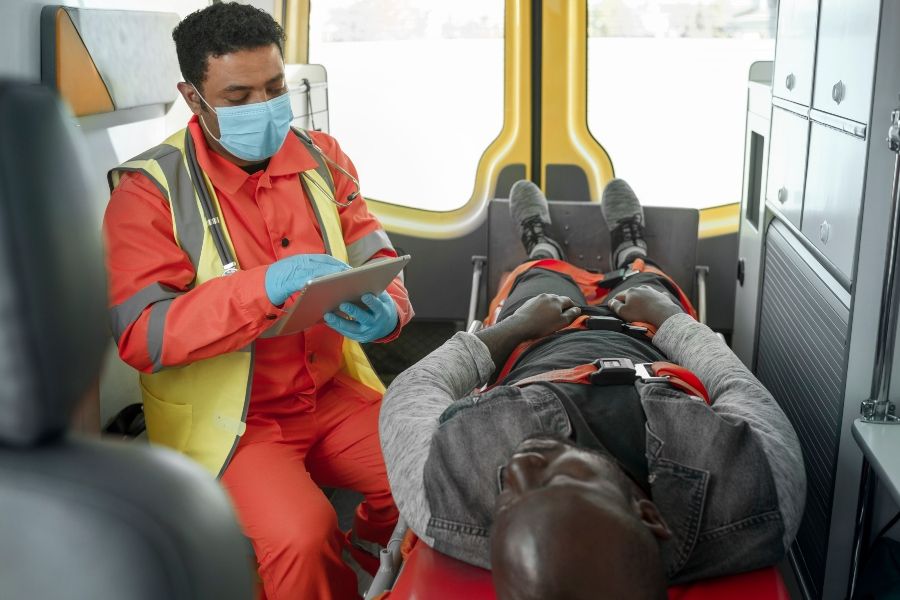 high-angle-paramedic-holding-tablet - 900x600.jpg