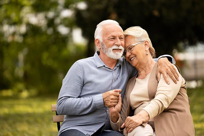 medium_shot_smiley_senior_couple_sitting_286124fe27.jpg