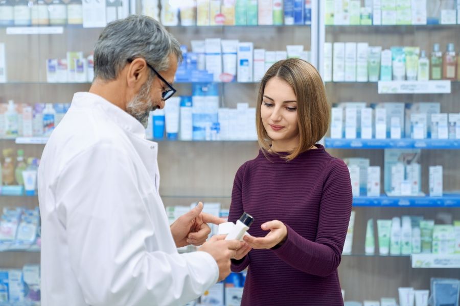 pharmacist-helping-woman-medicine-choice - 900x600.jpg