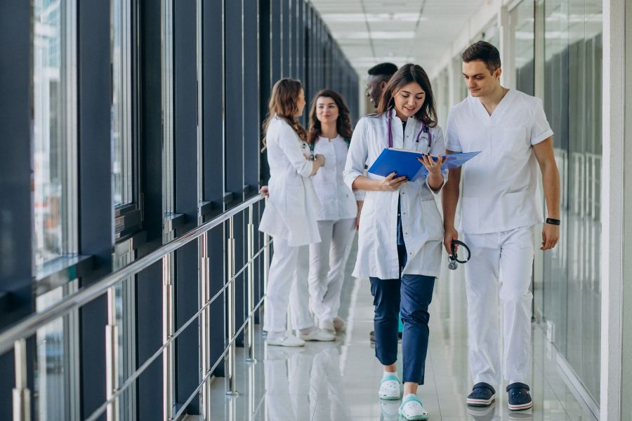 team-young-specialist-doctors-standing-corridor-hospital - 900x600.jpg